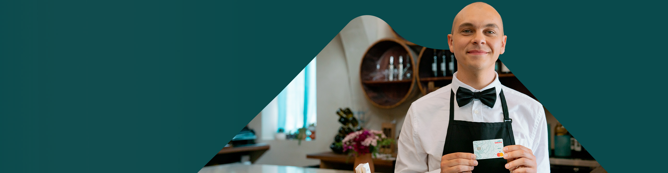 waiter holding sandia area debit card