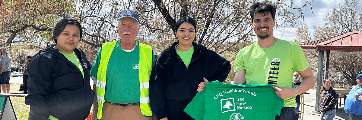 Volunteers posing for a photo at a tree palnting event