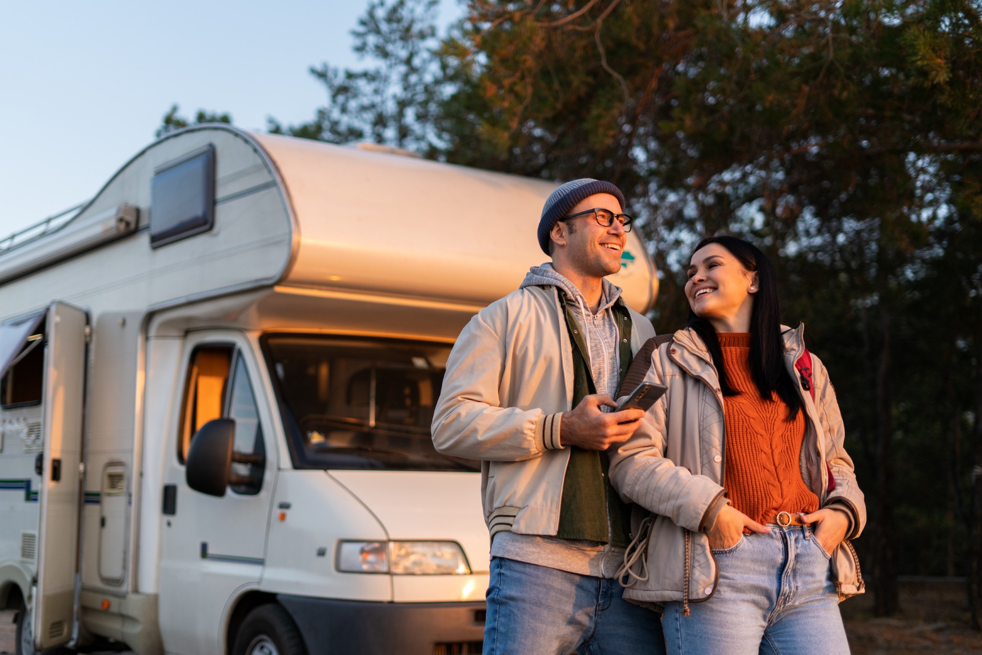 couple standing in front of their RV