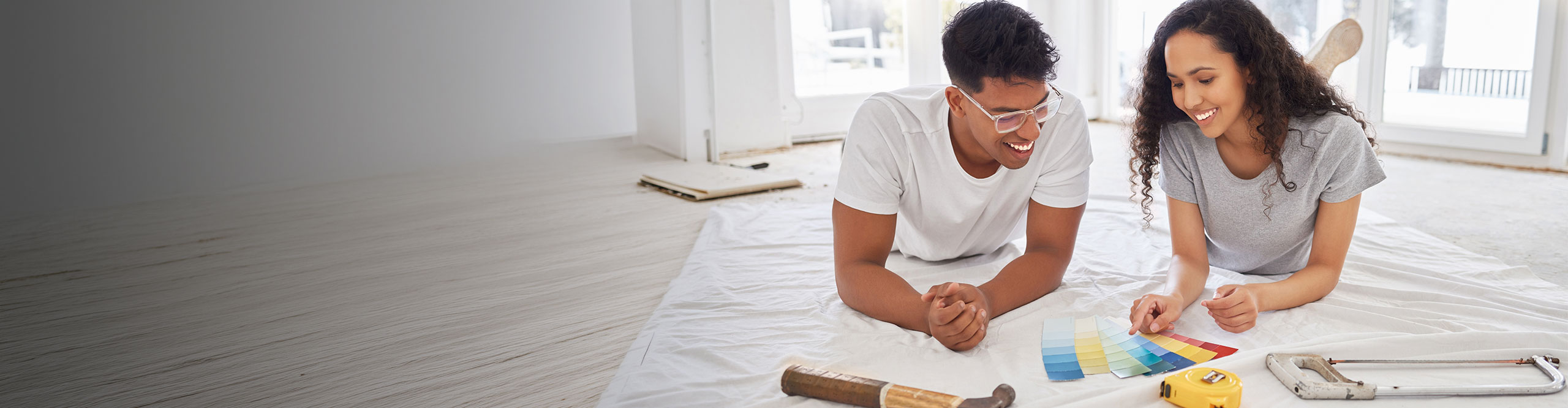 Mother and son raking leaves in the yard