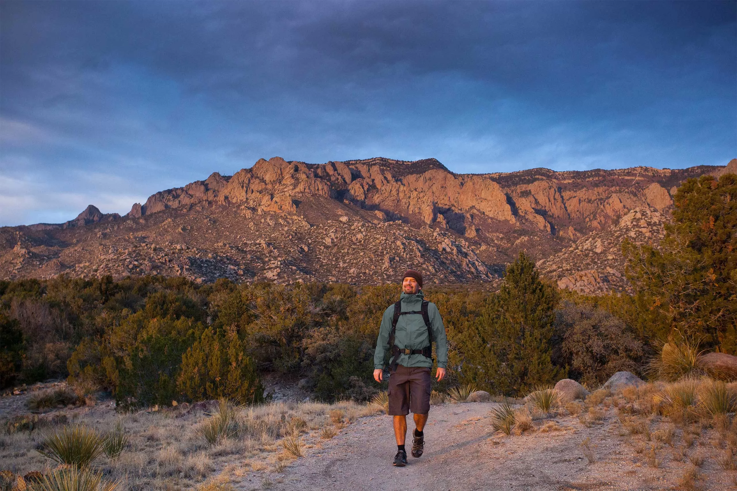 man hiking the Sandia Mountains in New Mexico