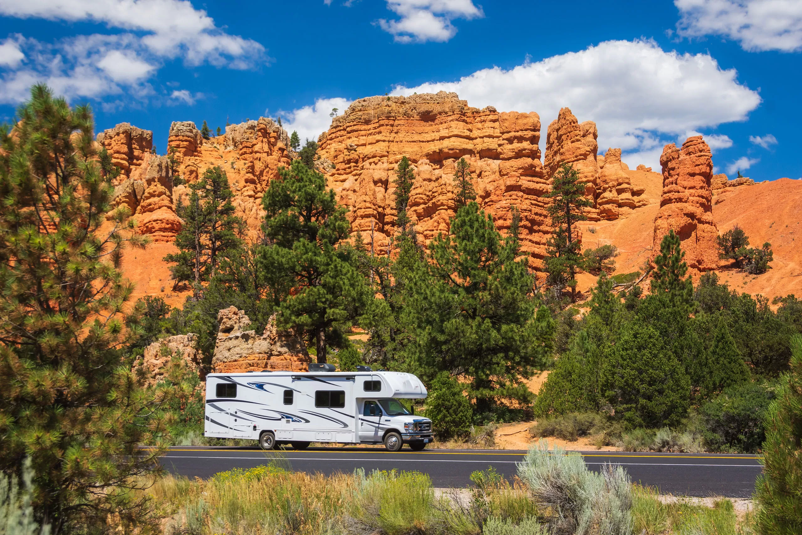 RV driving through the mountains in a national park