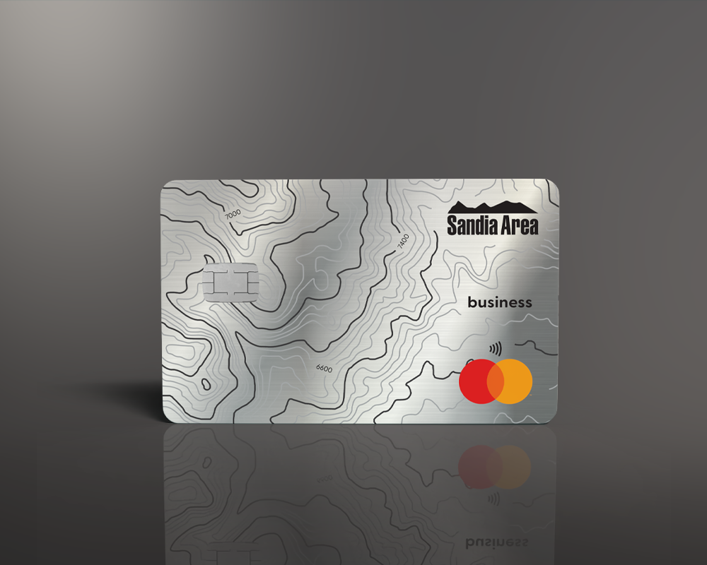 gray metal credit card on gray background