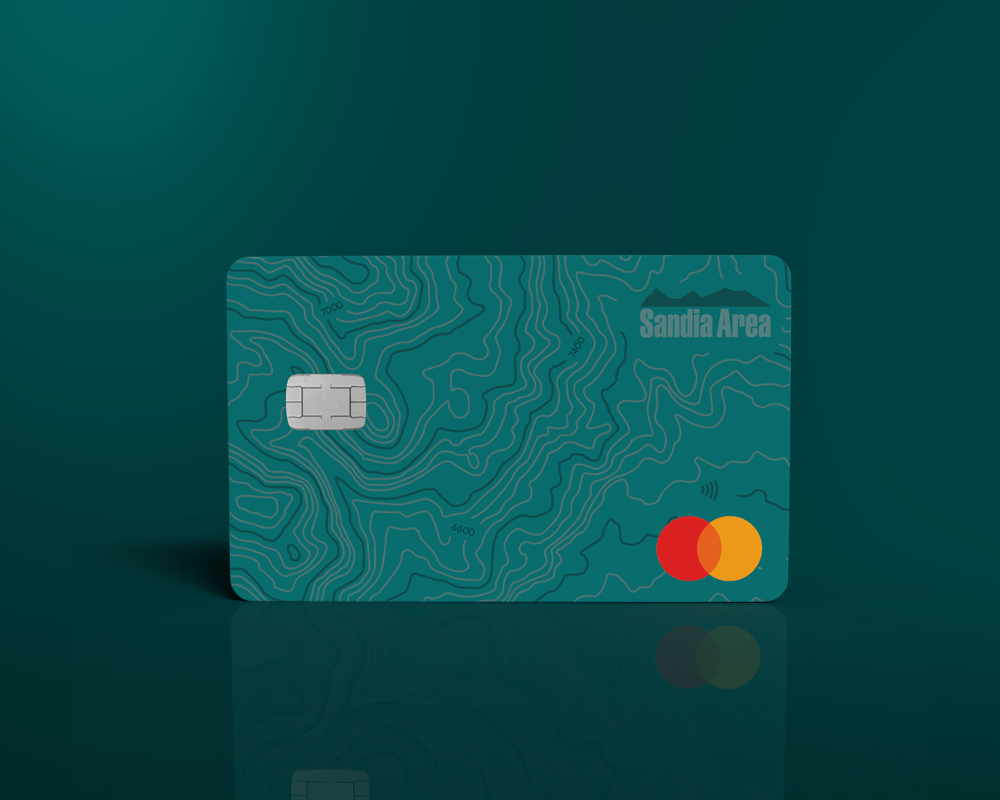 teal credit card on teal background