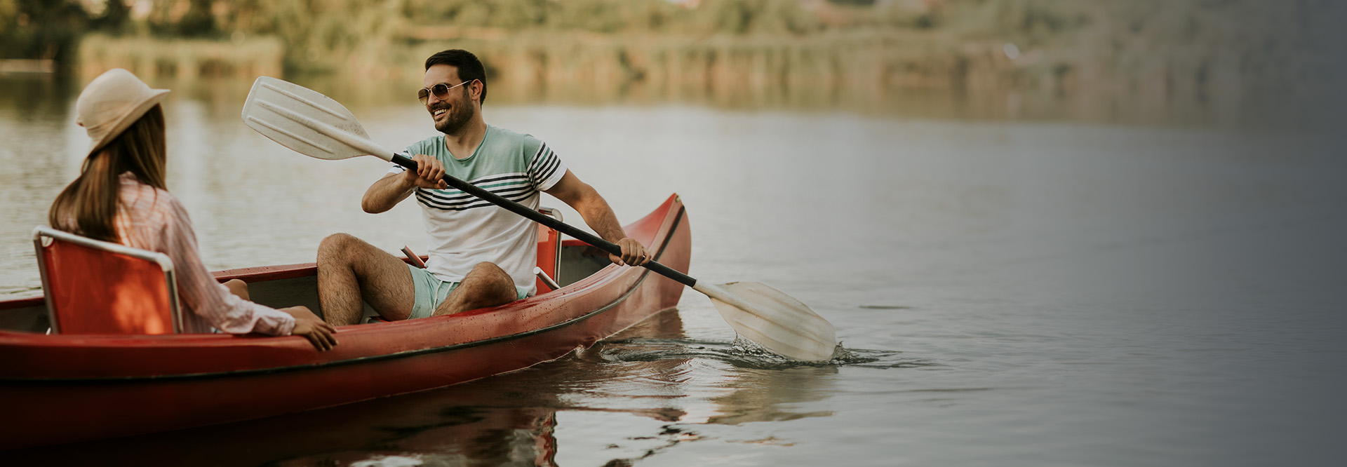 couple canoeing on a lake